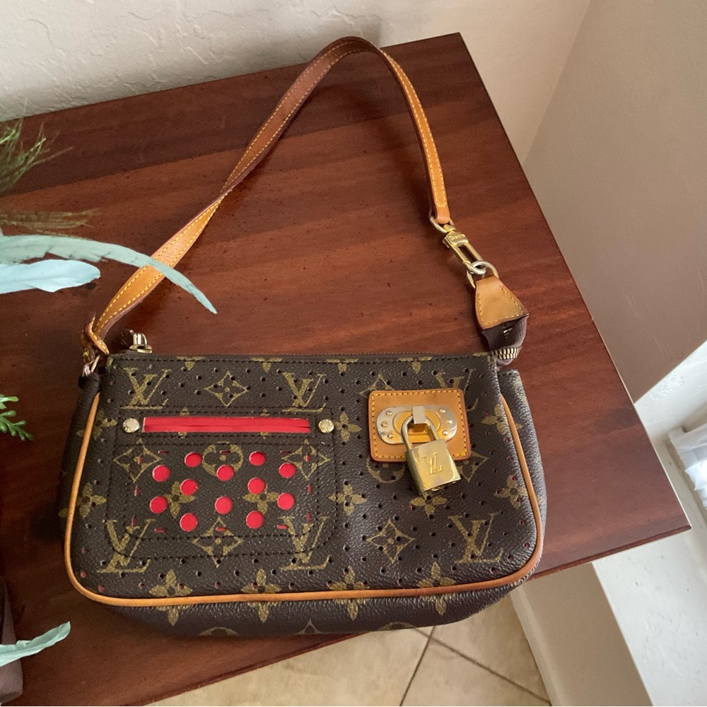 LV “red” perforated pochette